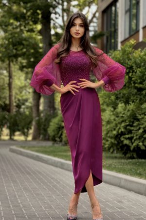 Woman in Geelong wearing a mother of the bride or groom dress in plum.